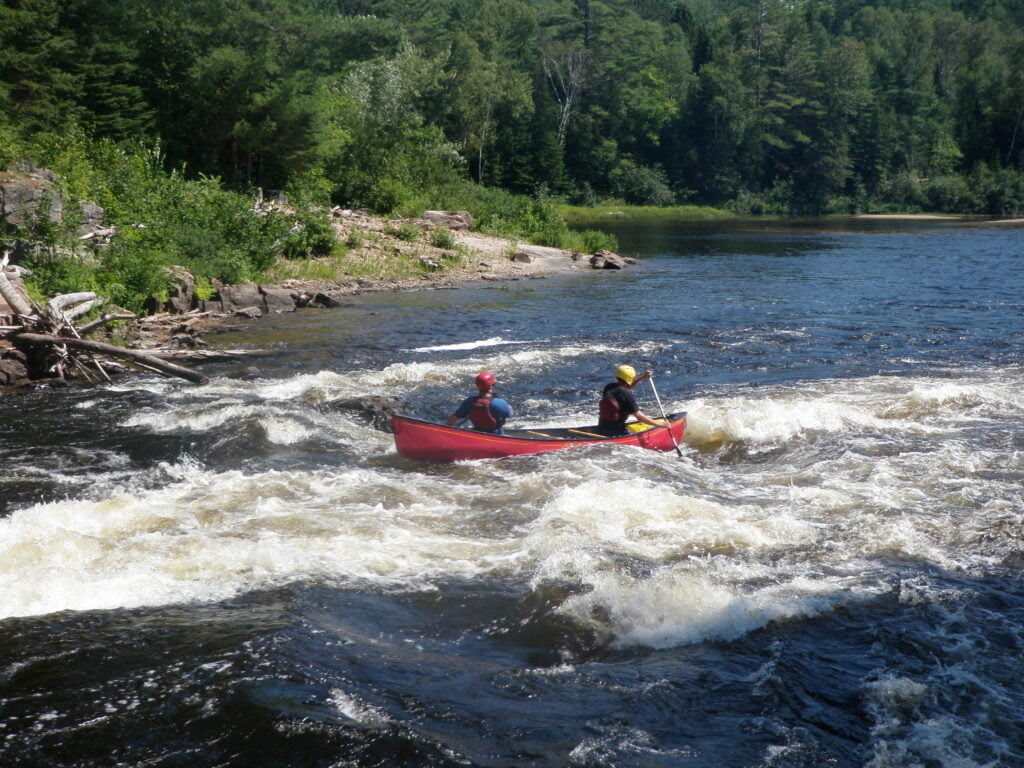 Canoe going through 50-50 rapid on Noire river