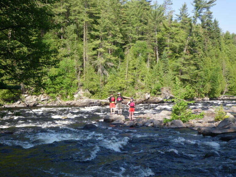 Standing on an island in the middle of the rapids studying the line