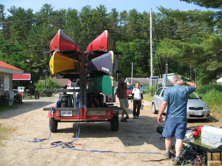 Multiple canoes racked on a trailer