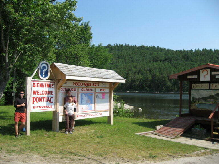 Posing next to the Welcome to Pontiac sign 