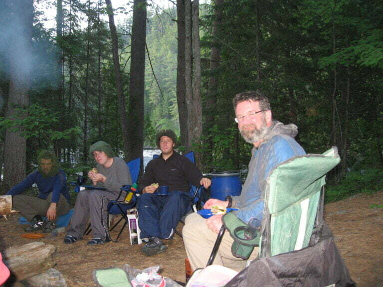 Sitting around the campfire eating dinner