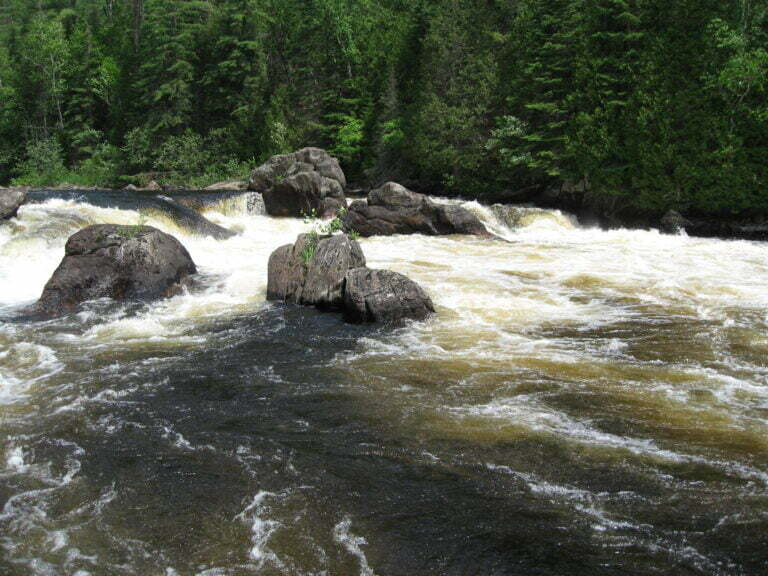whitewater flowing between large rocks