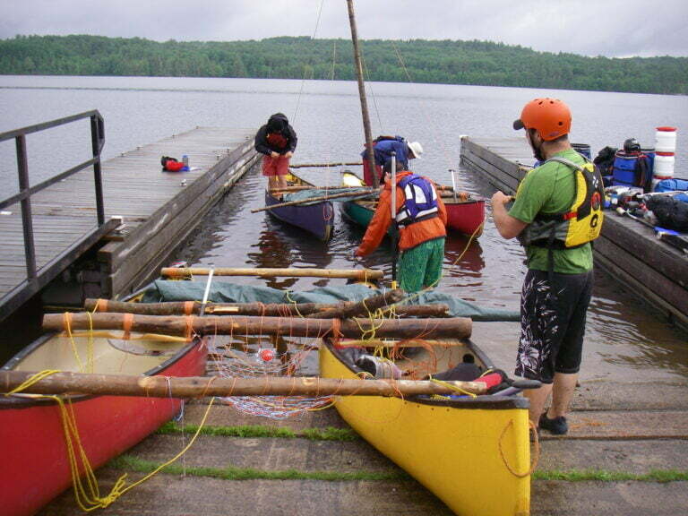 pulling canoe catamaran and canoe trimaran on boat launch